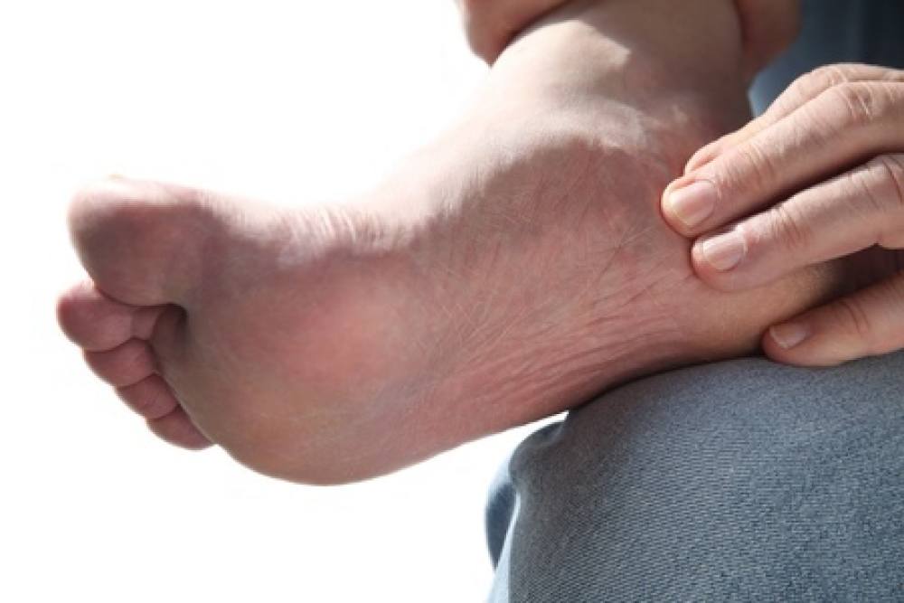 man with foot pain