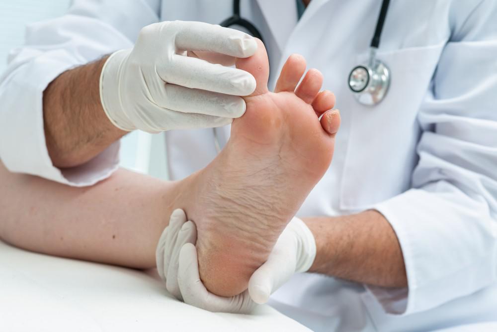 a foot doctor holding a foot