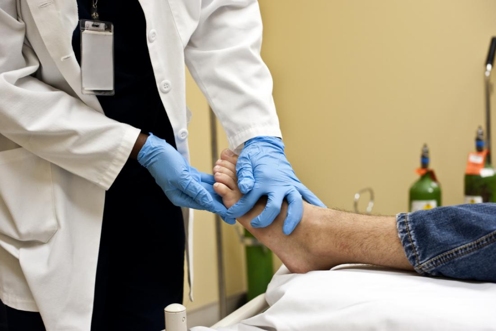 doctor holding a foot