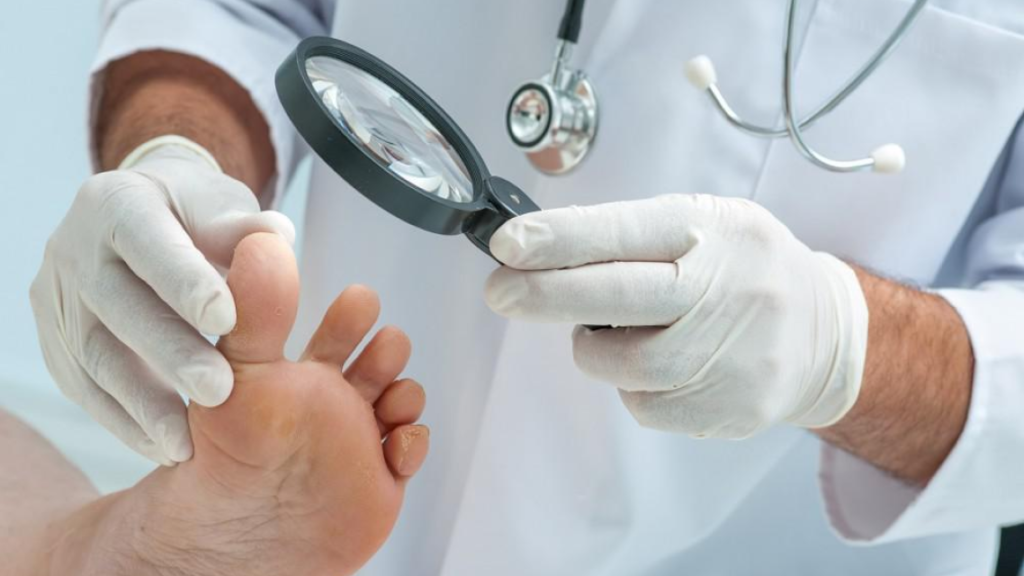 a podatrist use a magnifaying glass to examine a feet