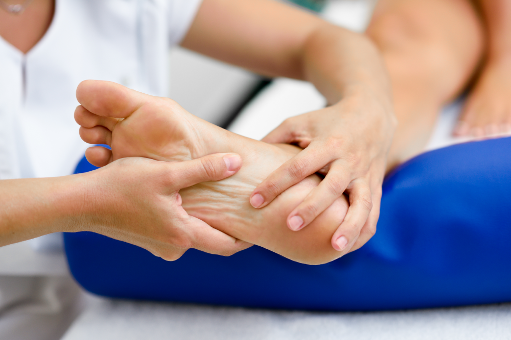 man massaging a foot