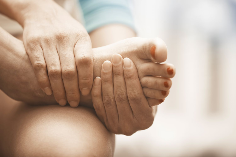 woman suffering from foot pain